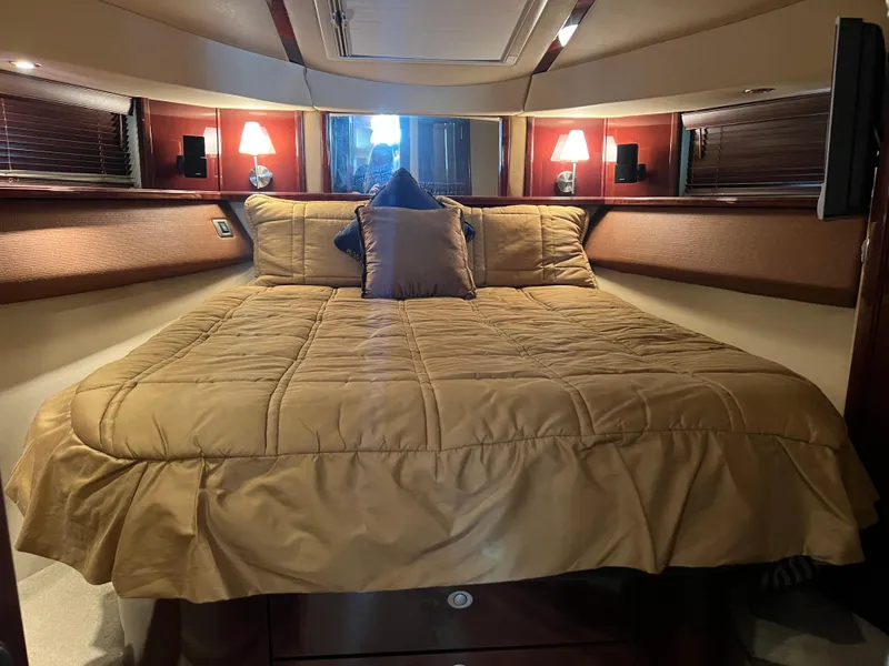 Slide: The Image of Luxurious bedroom interior of 2007 Sea Ray 52 Sedan Bridge yacht with elegant bedding. - 47