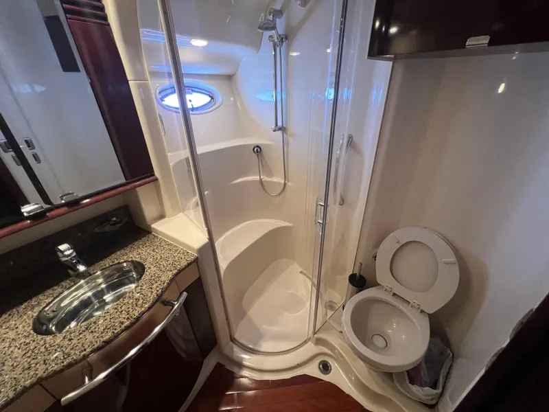 Slide: The Image of Luxurious 2007 Sea Ray 52 Sedan Bridge bathroom with shower and granite countertop. - 49
