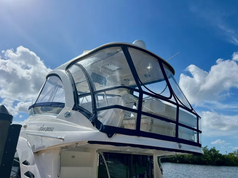 Slide: The Image of 2007 Sea Ray 52 Sedan Bridge yacht against a bright blue sky. - 7