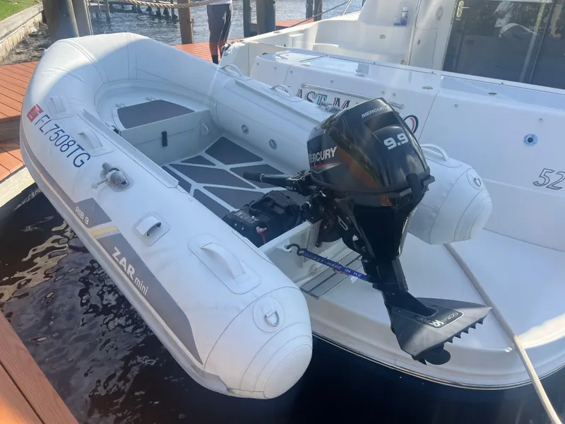 Slide: The Image of Inflatable boat with Mercury 9.9 motor on 2007 Sea Ray 52 Sedan Bridge. - 9
