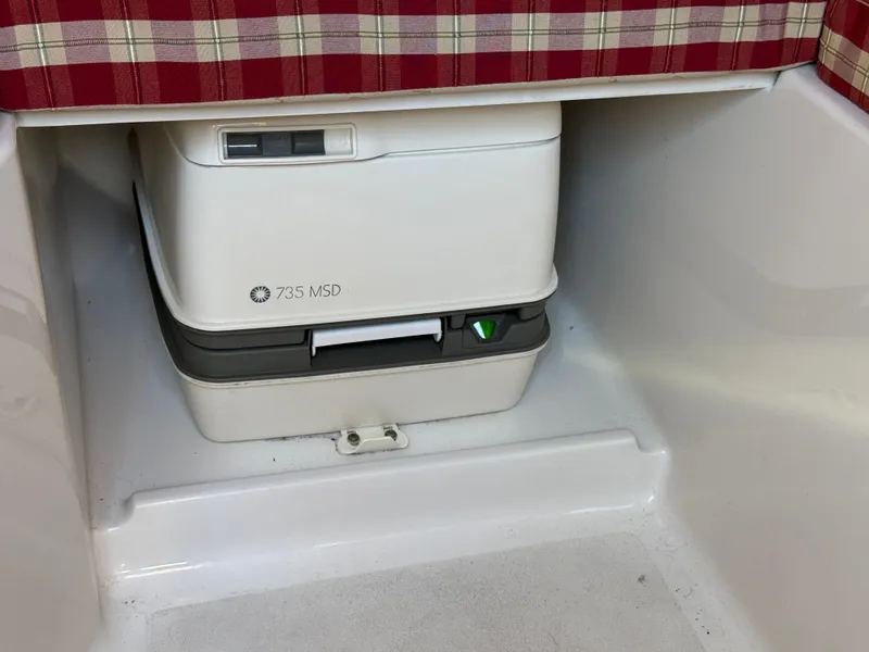 Slide: The Image of Portable toilet in 2005 Chris-Craft Corsair 28 boat interior. - 23