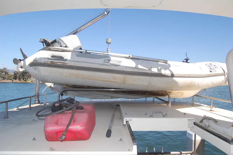 Slide: The Image of 1981 Hatteras 48 Cockpit MY with dinghy and fuel tank on deck. - 43