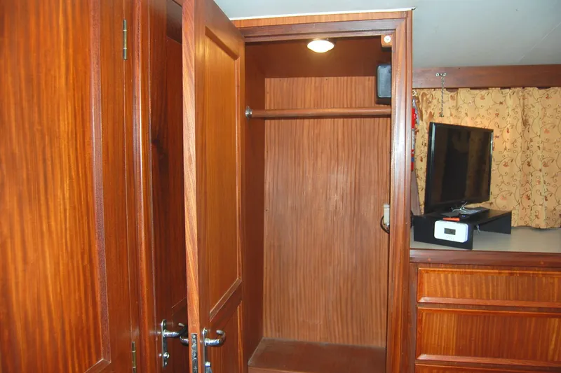Slide: The Image of Wooden closet interior on 1981 Hatteras 48 Cockpit MY yacht. - 24