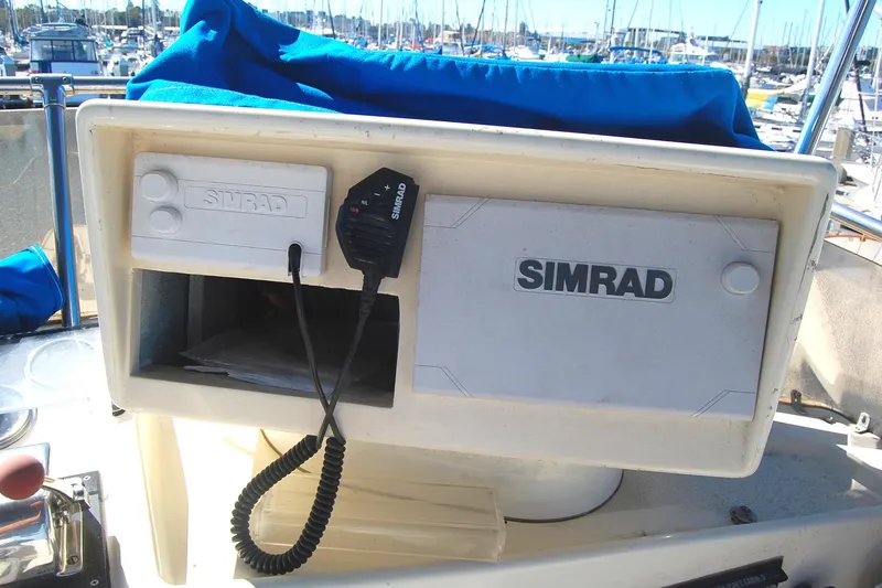 Slide: The Image of Simrad marine equipment on 1981 Hatteras 48 Cockpit MY yacht, docked at marina. - 41