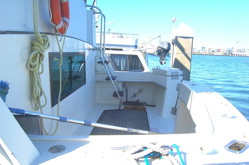 Slide: The Image of 1981 Hatteras 48 Cockpit MY yacht with spacious deck and ocean view. - 44