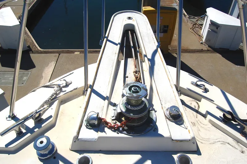 Slide: The Image of 1981 Hatteras 48 Cockpit MY yacht deck with winch and railing. - 48