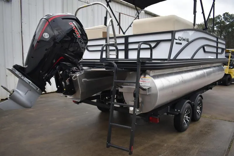 Slide: The Image of 2023 Lowe SF212 Walk-Through pontoon boat with outboard motor and trailer. - 11