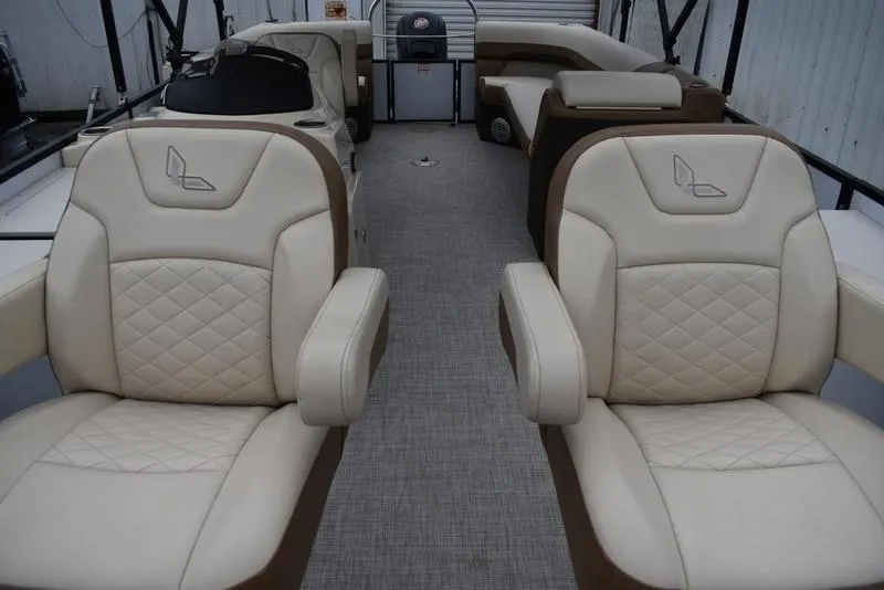 Slide: The Image of 2023 Lowe SF212 Walk-Through boat interior with beige seating and modern design. - 14