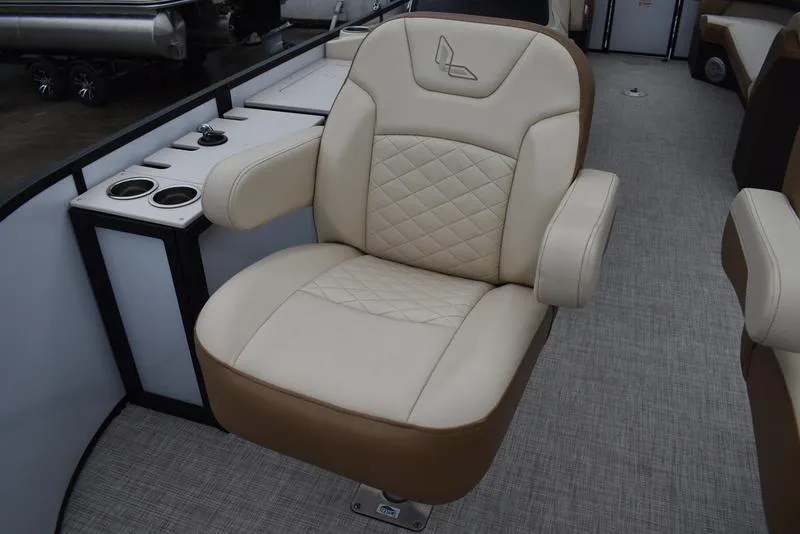 Slide: The Image of Luxurious seating on 2023 Lowe SF212 Walk-Through boat, featuring cup holders and elegant design. - 15