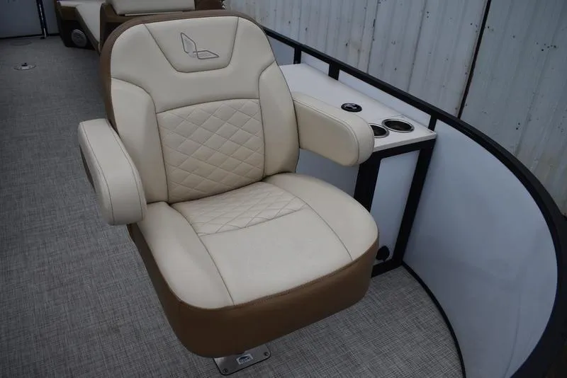 Slide: The Image of 2023 Lowe SF212 Walk-Through boat seat with beige upholstery and armrests. - 16