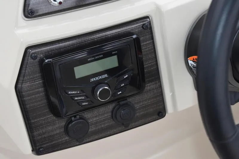 Slide: The Image of 2023 Lowe SF212 Walk-Through boat dashboard with Kicker media center. - 23