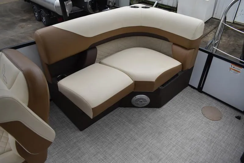 Slide: The Image of 2023 Lowe SF212 Walk-Through boat interior with beige and brown seating. - 27