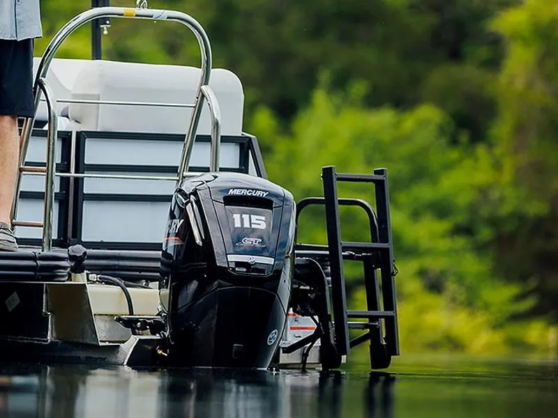 Slide: The Image of 2023 Lowe SF212 Walk-Through boat with Mercury 115 engine on a calm lake. - 34