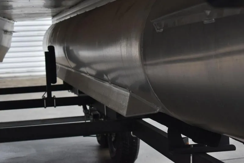 Slide: The Image of 2023 Lowe SF212 Walk-Through pontoon boat underside on trailer. - 6