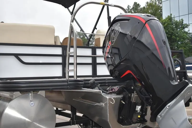 Slide: The Image of 2023 Lowe SF212 Walk-Through pontoon boat with powerful outboard motor. - 9