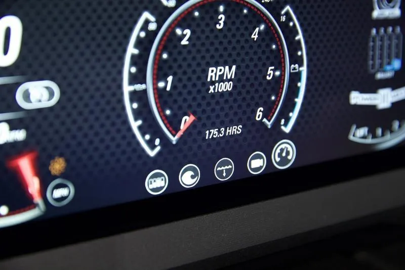 Slide: The Image of 2021 Malibu 21 MLX dashboard displaying RPM gauge and 175.3 hours usage. - 11