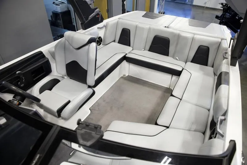 Slide: The Image of 2021 Malibu 21 MLX boat interior with spacious seating and modern design. - 16