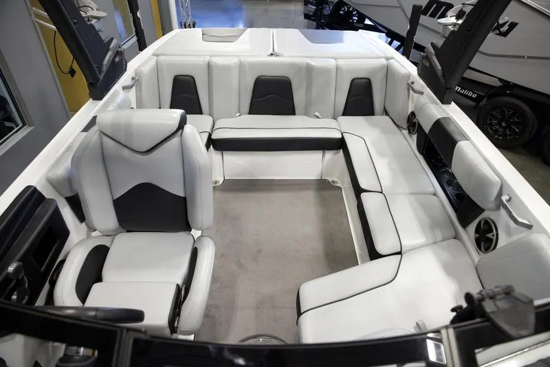 Slide: The Image of Interior of 2021 Malibu 21 MLX boat with white and black seating. - 17