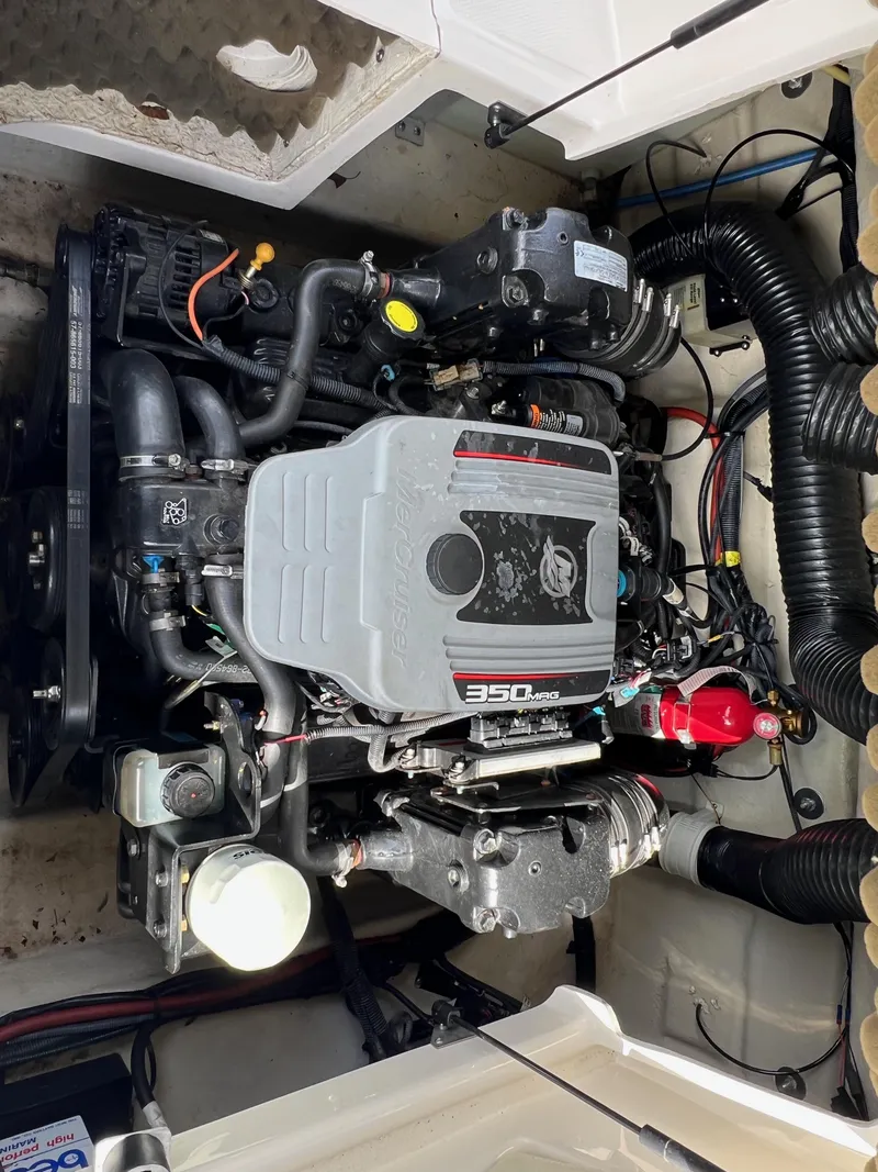 Slide: The Image of 2009 Sea Ray 240 Sundeck engine compartment with 350 MAG engine. - 11