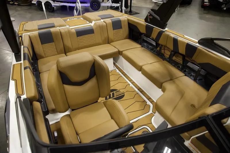 Slide: The Image of Luxurious interior of 2025 Malibu 22 MXZ boat with tan leather seating. - 19