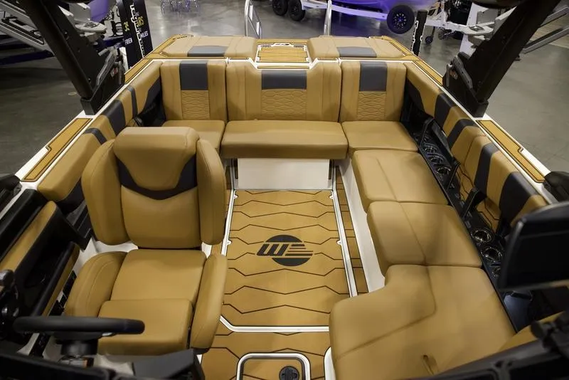 Slide: The Image of 2025 Malibu 22 MXZ boat interior with luxurious tan seating and modern design. - 20