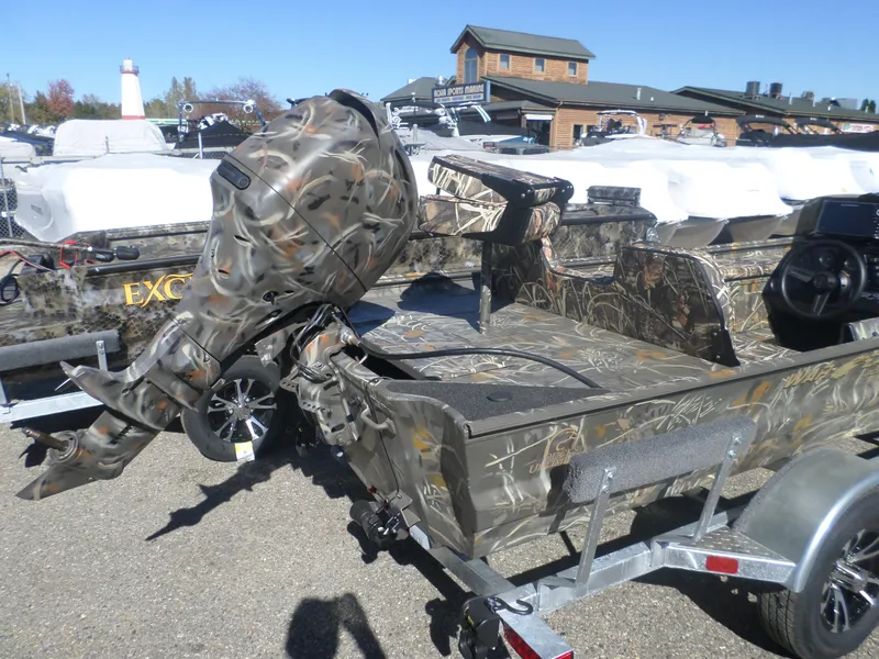 Slide: The Image of 2025 War Eagle 754 DSV boat with camo design on a trailer. - 3