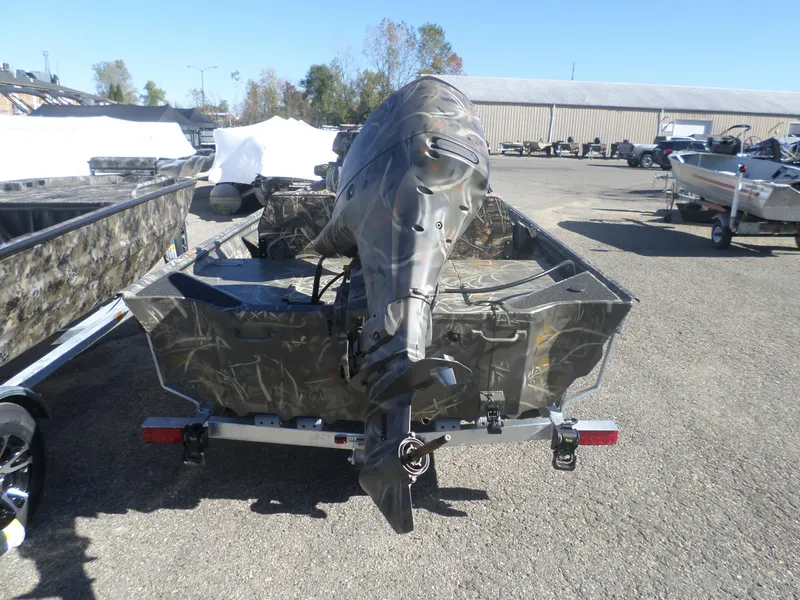 Slide: The Image of 2025 War Eagle 754 DSV boat with camouflage design, parked on a trailer. - 4