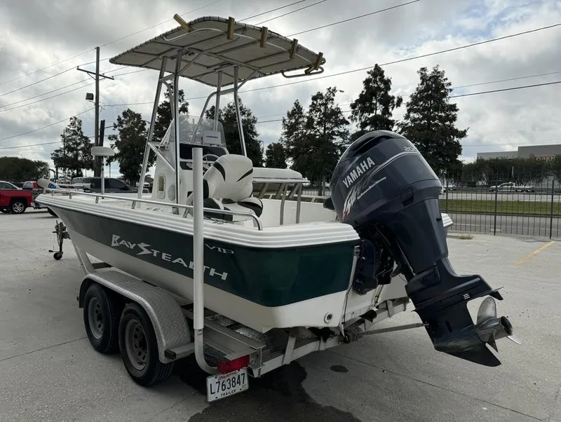 Slide: The Image of 2001 Bay Stealth VIP 2230 boat with Yamaha outboard motor on trailer. - 11