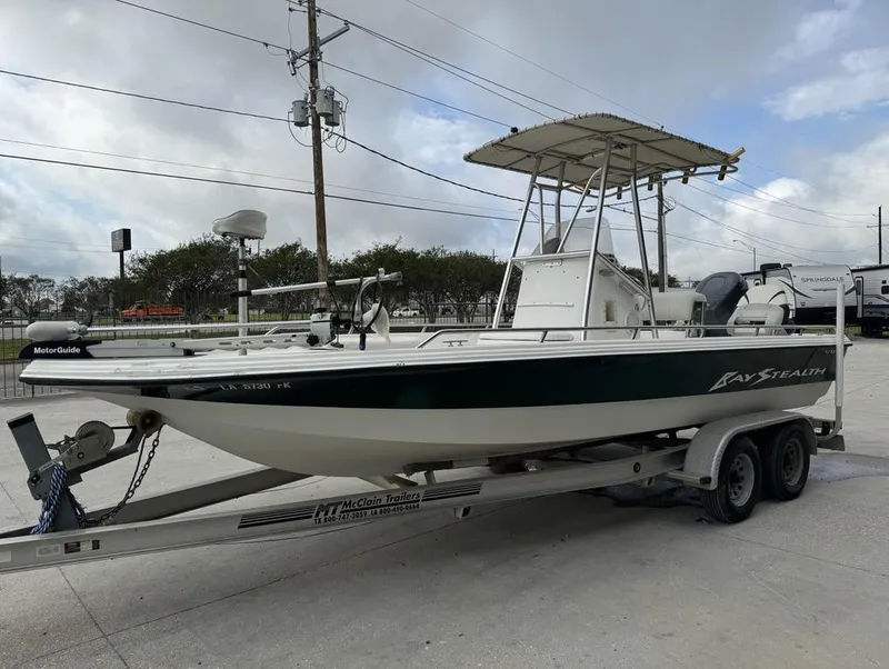 Slide: The Image of 2001 Bay Stealth VIP 2230 boat on trailer, parked outdoors. - 16
