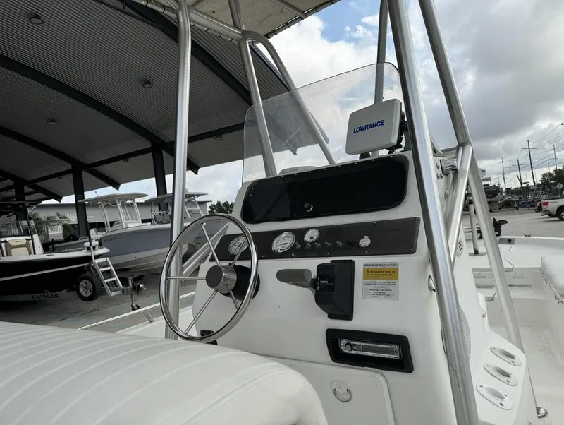 Slide: The Image of 2001 Bay Stealth VIP 2230 boat console with steering wheel and gauges. - 5