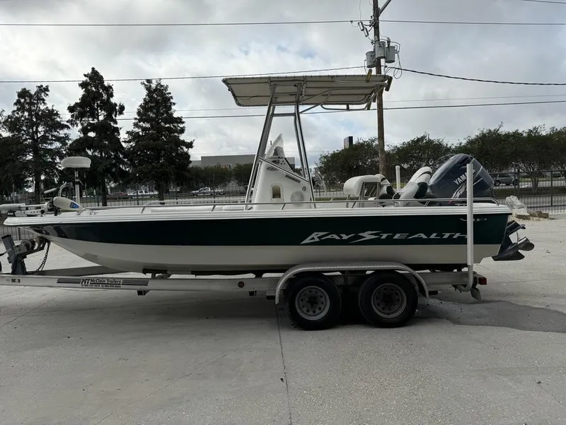 Slide: The Image of 2001 Bay Stealth VIP 2230 boat on trailer, parked outdoors. - 7