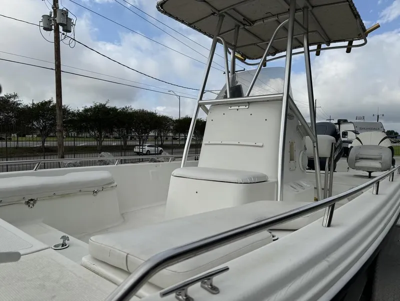 Slide: The Image of 2001 Bay Stealth VIP 2230 boat with seating and canopy, parked outdoors. - 8