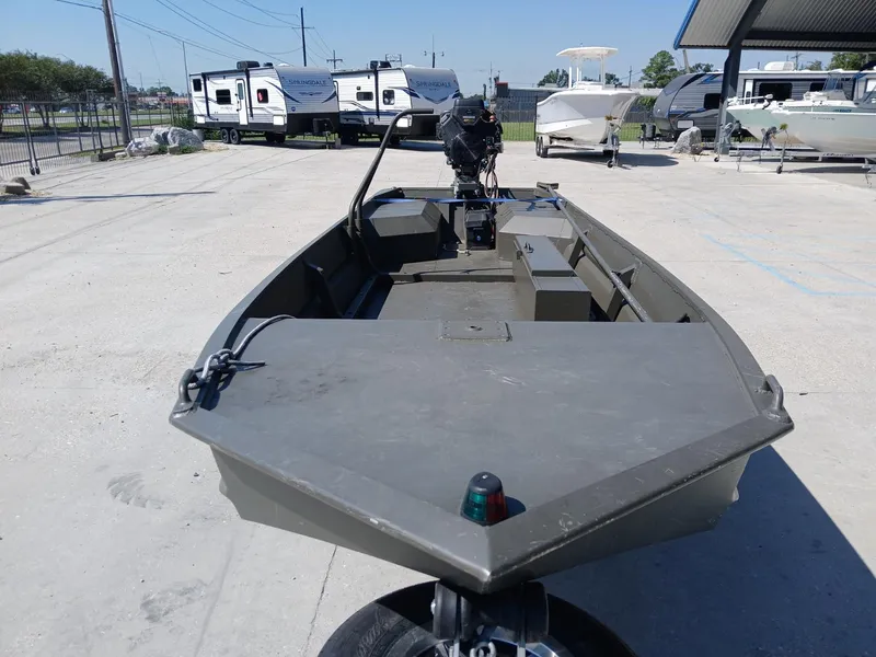 Slide: The Image of 2023 Go-Devil 18x48 boat in a parking lot with trailers and boats. - 10