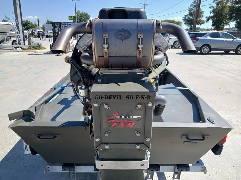 Slide: The Image of 2023 Go-Devil 18x48 boat with surface drive engine, parked outdoors. - 7