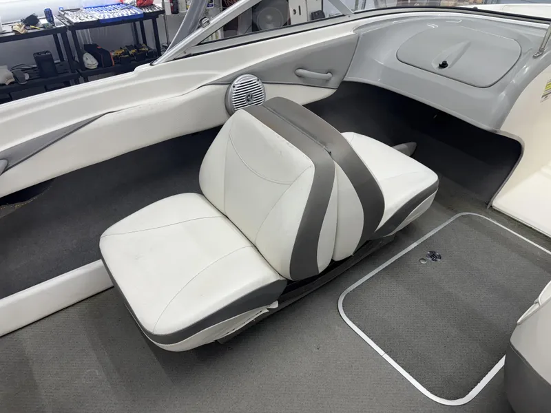 Slide: The Image of 2008 Bayliner Bowrider 185 interior with white and gray seating. - 5