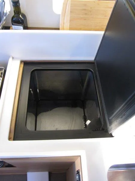 Slide: The Image of Jeanneau Sun Odyssey 440 (2021) galley storage compartment with open lid. - 10