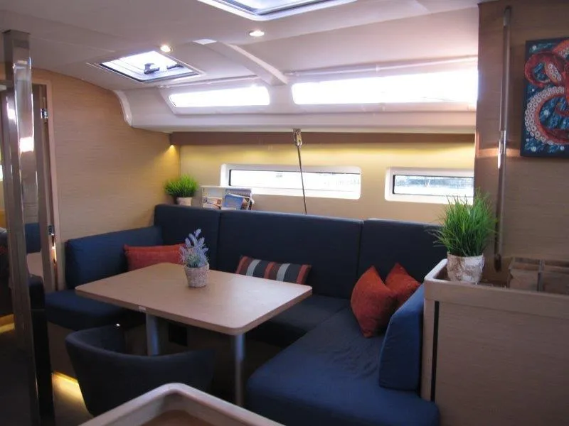 Slide: The Image of Interior of 2021 Jeanneau Sun Odyssey 440 yacht with cozy seating and modern decor. - 14