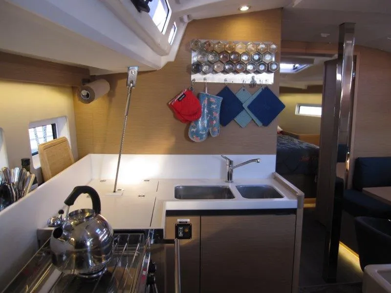 Slide: The Image of Modern kitchen interior of 2021 Jeanneau Sun Odyssey 440 yacht with stainless steel appliances. - 15