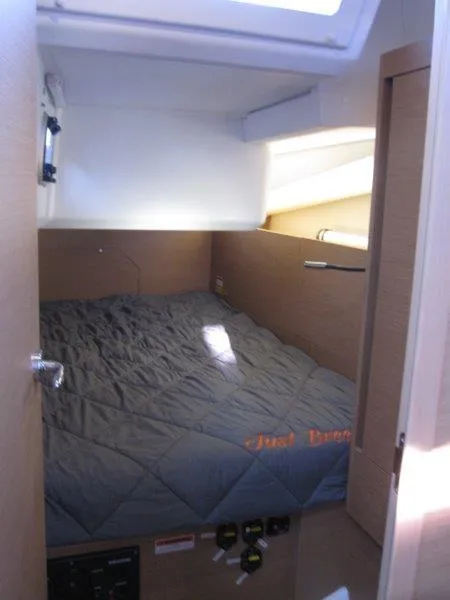 Slide: The Image of Interior cabin of 2021 Jeanneau Sun Odyssey 440 sailboat with cozy bed. - 21