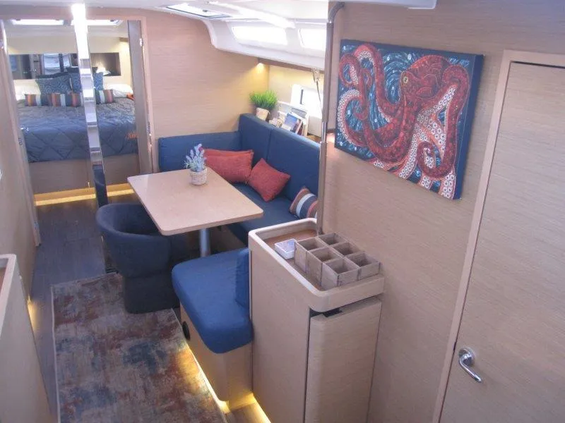 Slide: The Image of Interior of 2021 Jeanneau Sun Odyssey 440 yacht with cozy seating and octopus artwork. - 3