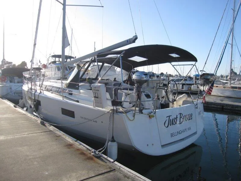 Slide: The Image of 2021 Jeanneau Sun Odyssey 440 sailboat docked at marina, named "Just Breeze". - 36