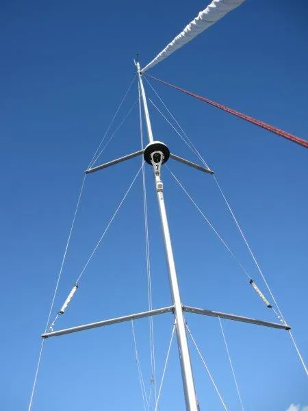 Slide: The Image of Mast of 2021 Jeanneau Sun Odyssey 440 sailboat against clear blue sky. - 41