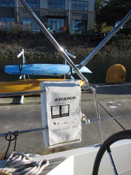 Slide: The Image of Jeanneau Sun Odyssey 440 sailboat with Lifesling, docked near kayaks, 2021 model. - 48