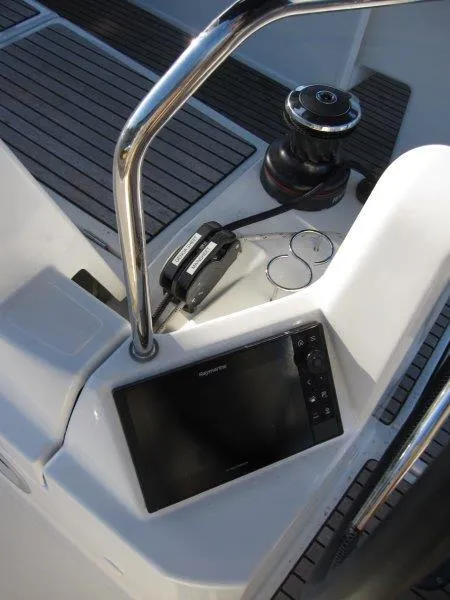 Slide: The Image of Jeanneau Sun Odyssey 440 cockpit with navigation equipment, winch, and teak flooring, 2021 model. - 49