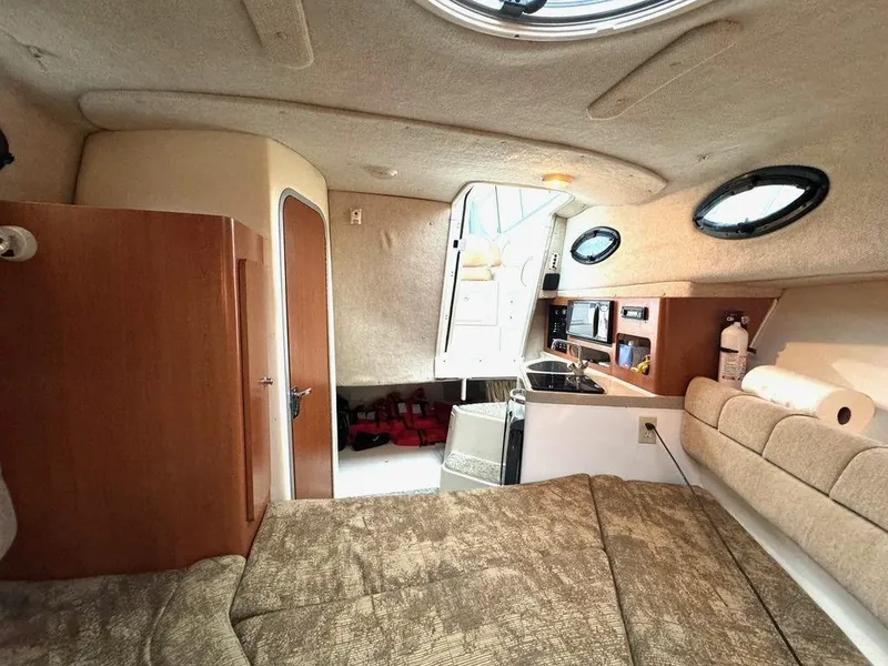 Slide: The Image of Interior of 2006 Seaswirl 2901 boat with cozy cabin and kitchenette. - 12