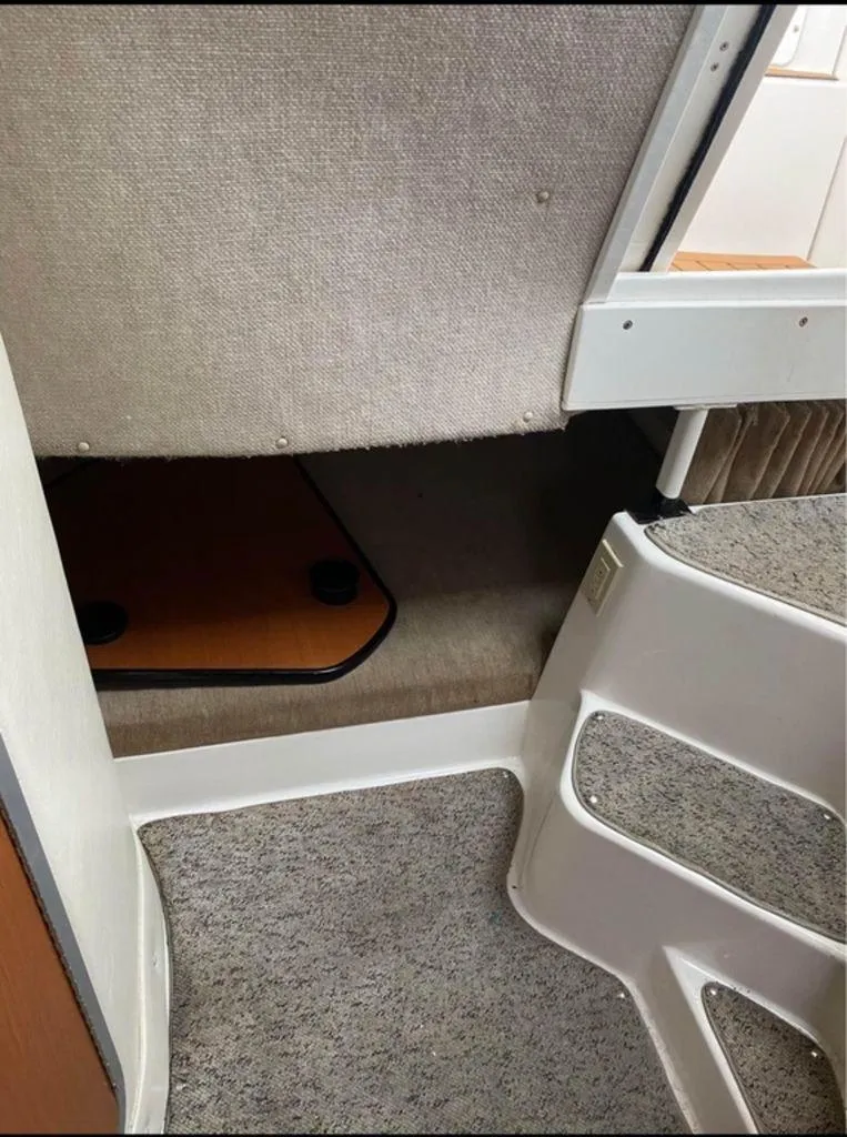 Slide: The Image of Interior cabin of 2006 Seaswirl 2901 boat with carpeted steps and seating area. - 13