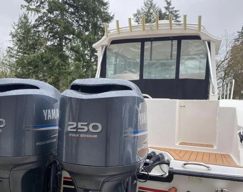 Slide: The Image of 2006 Seaswirl 2901 boat with dual Yamaha 250 four-stroke engines, docked outdoors. - 14