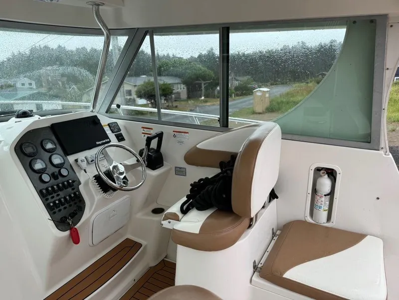 Slide: The Image of Interior of 2006 Seaswirl 2901 boat with steering wheel and control panel. - 6