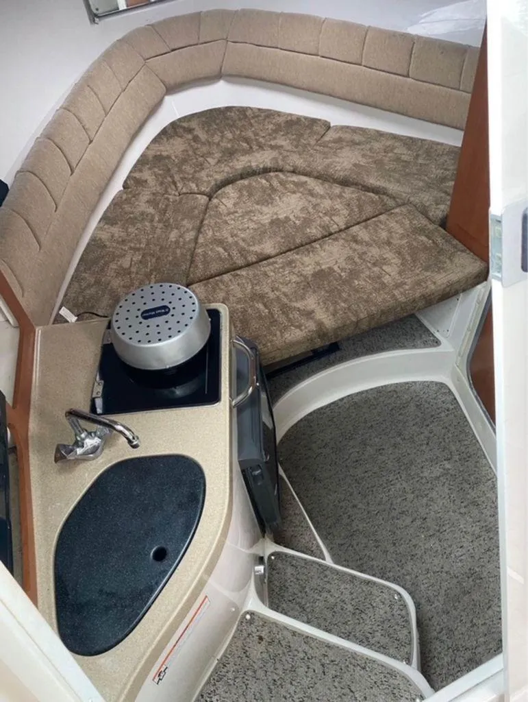 Slide: The Image of 2006 Seaswirl 2901 boat interior with seating and kitchenette area. - 9