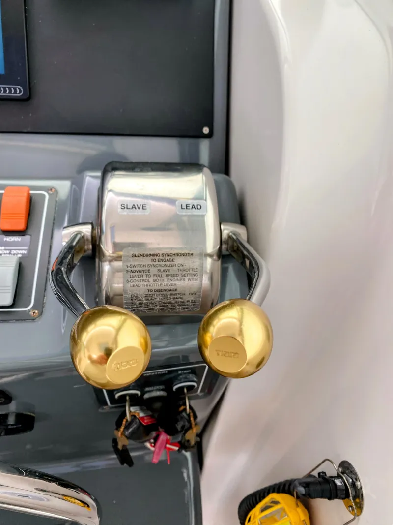 Slide: The Image of Throttle controls on a 2001 Tiara Yachts 3800 Open boat dashboard. - 22